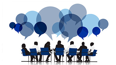 Energy & Utility Skills Consultancy. People sat together talking.