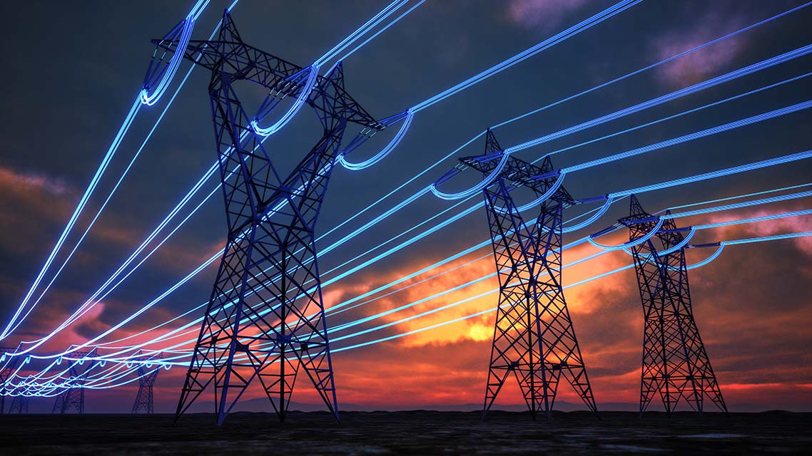Steel electricity transmission towers stretch across the horizon at sunset, with digitally enhanced glowing blue lines representing energy flow through the power grid.