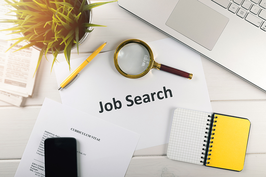 Job search items on white table iStock web